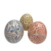 Uova piccole pasquali con decorazione azzurra, rosa, verde - foto 1