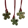 Collana con ciondolo fioriforme "faccina sorridente" con coccinella portafortuna - foto 1